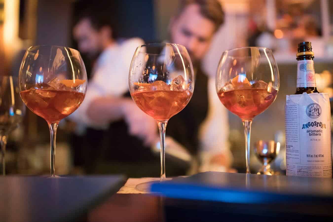 Bartender serving cocktails for a spirits tasting class